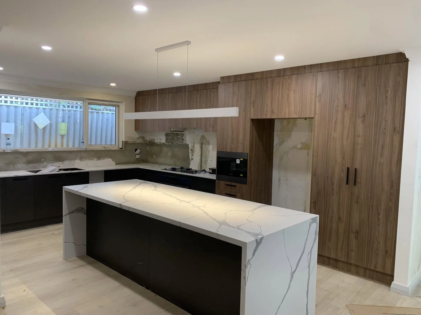 Kitchen featuring timber-look cabinetry and an island