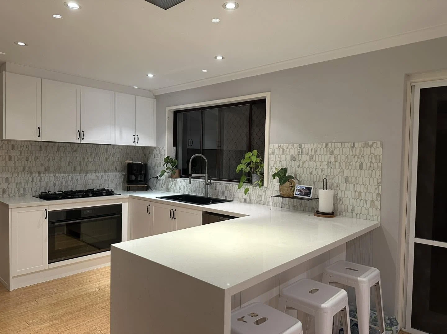 Island kitchen & tiled splashback
